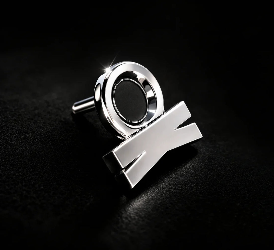 KORTONS platinum eyelet and aglet detail with reflective finish on a dark background