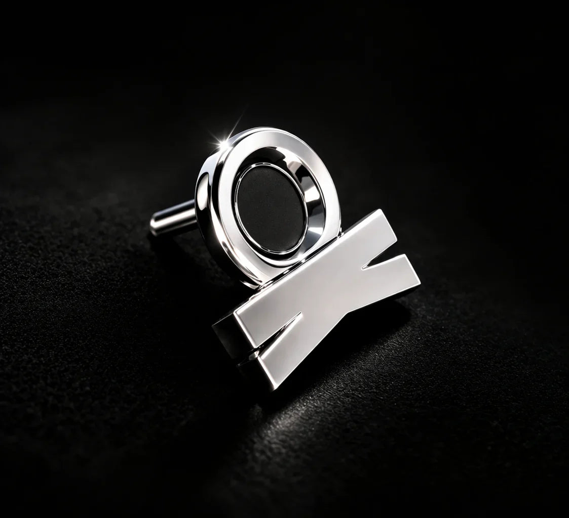 KORTONS platinum eyelet and aglet detail with reflective finish on a dark background