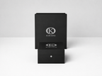 KORTONS luxury presentation box displayed before a matching signature packaging box on a clean light backdrop, featuring black semi-gloss finishes, refined proportions, and minimalist brand presentation.